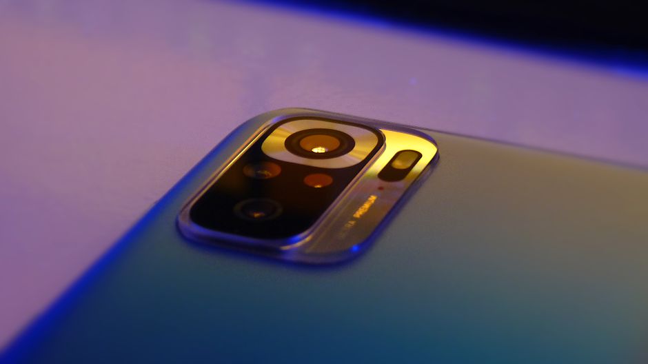 Macro shot of smartphone camera lens highlighting design and technology.
